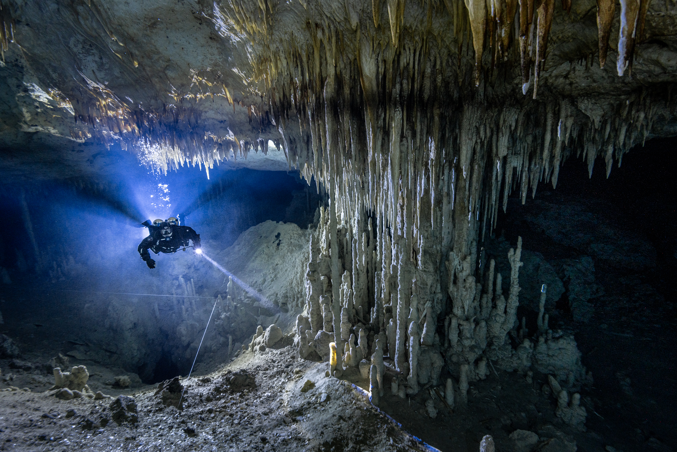 Limestone formations inside an underwater cave passage